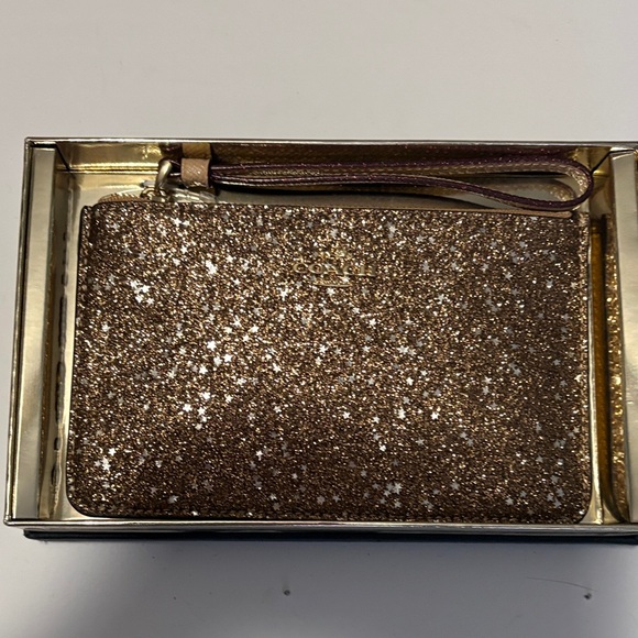 Coach Handbags - Coach Starry Glitter Wristlet in Brown